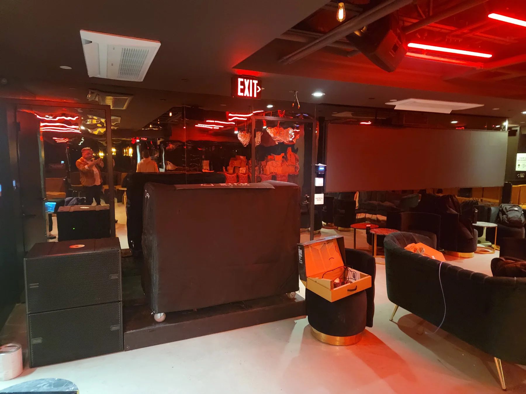 Entry view into Club STFU with LED surfaces glowing down the corridor
