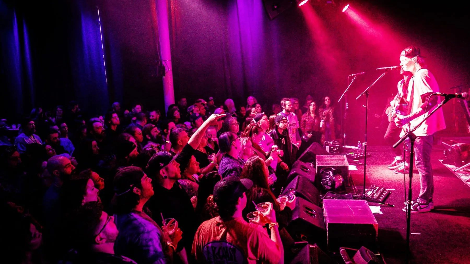 Musicians performing to a crowd at Reckless Shepherd