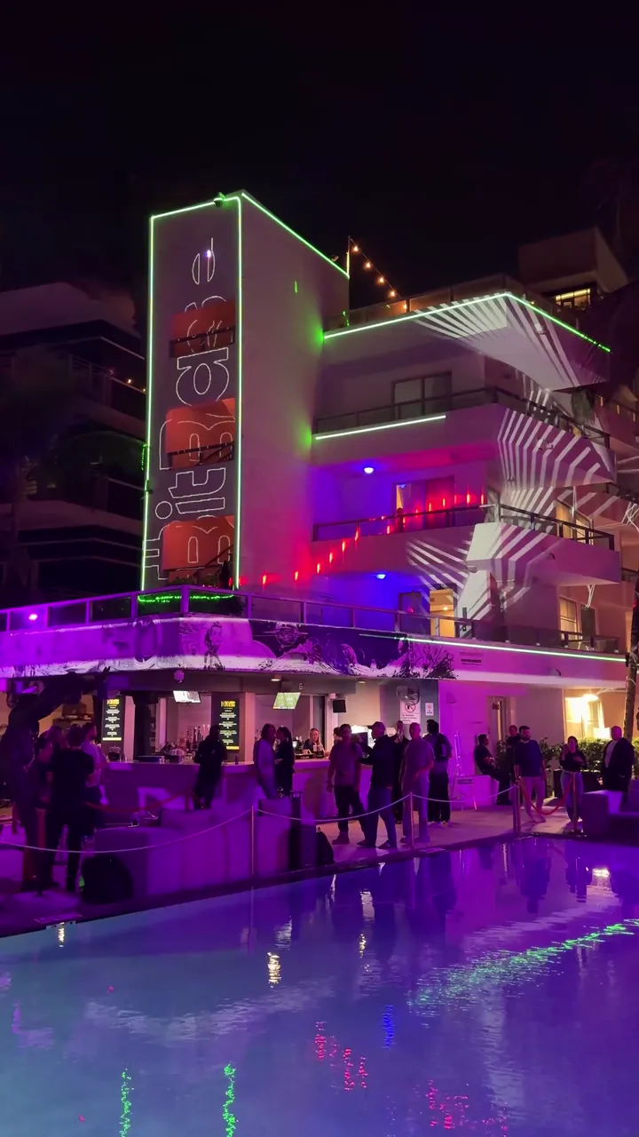 Projection mapped across a Miami building façade at night