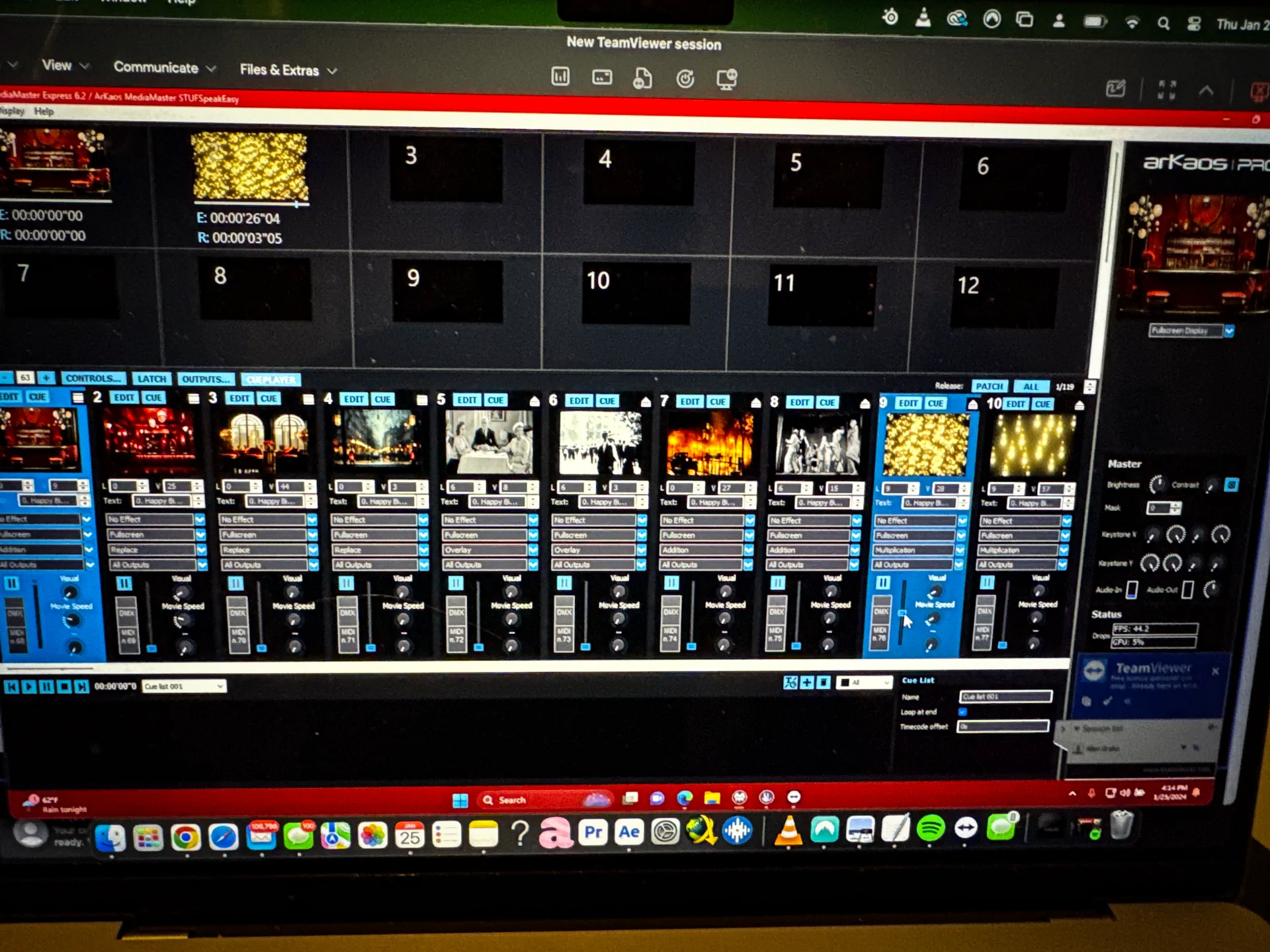 Operator laptop mid-show running ArKaos MediaMaster, cueing the room's content bank