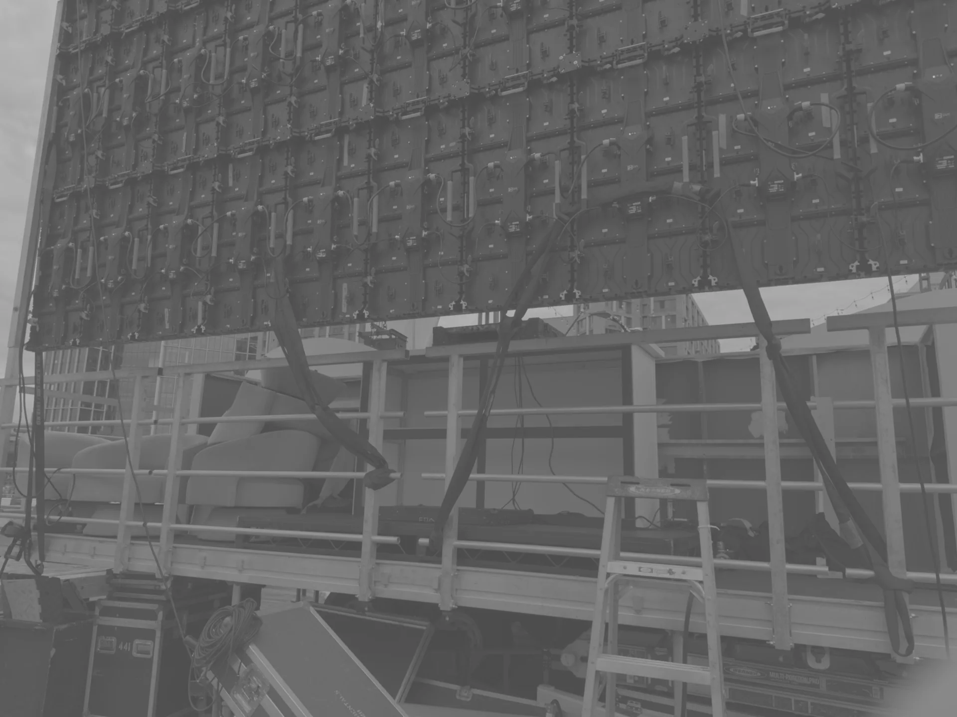 Rear of an LED panel wall showing the rigging and cable runs