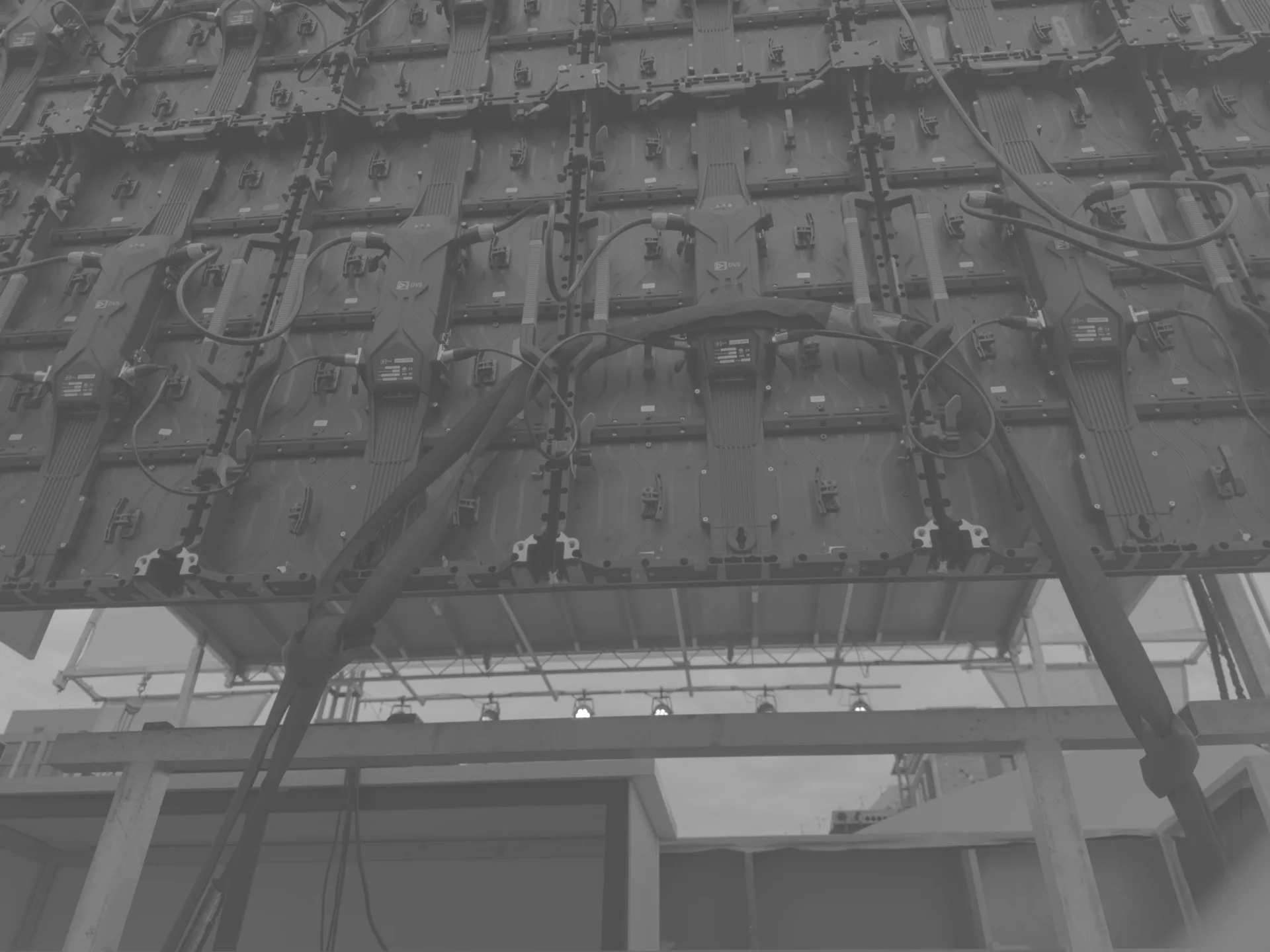 Rear of an LED panel wall from a lower angle, showing the rigging frame