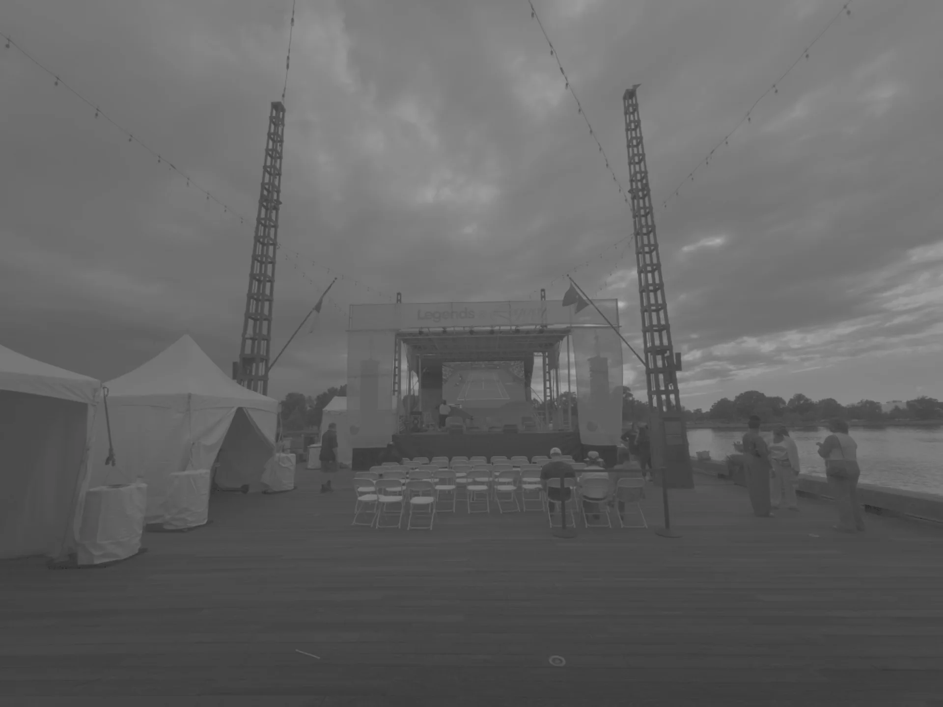 Wide view of the finished stage structure against an overcast sky